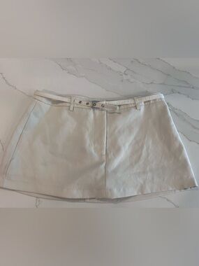 Casual Cream Mini Skirt with Front Belt Detail. Built in shorts.